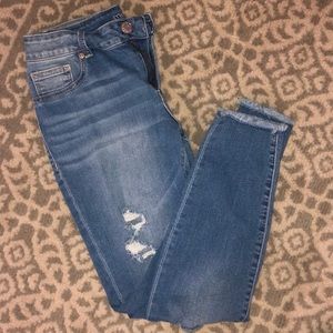 Distressed skinny jean with raw hem